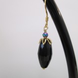 Black agate with gold earrings‏ detail