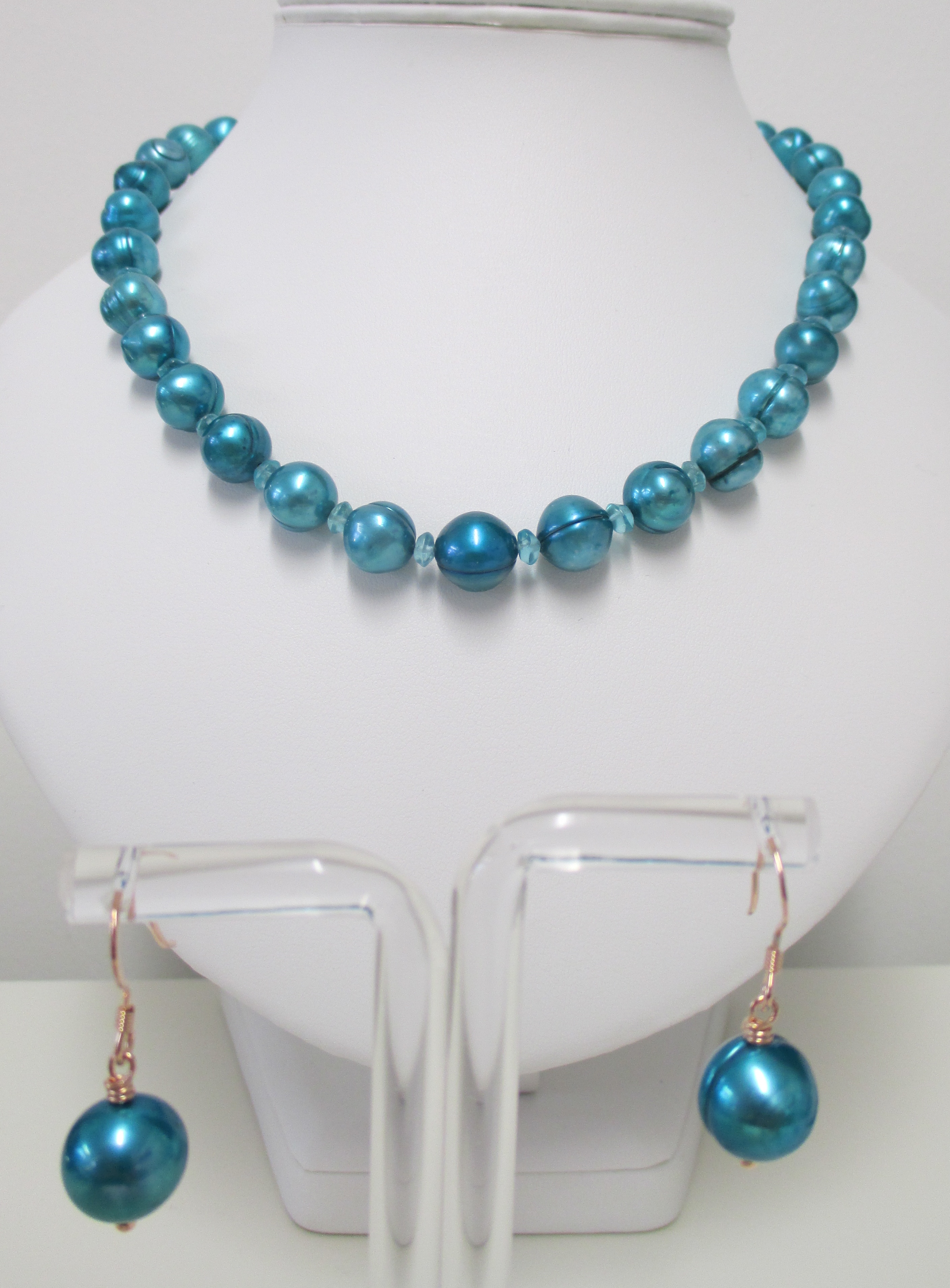 Large blue/teal pearls and blue apatite 